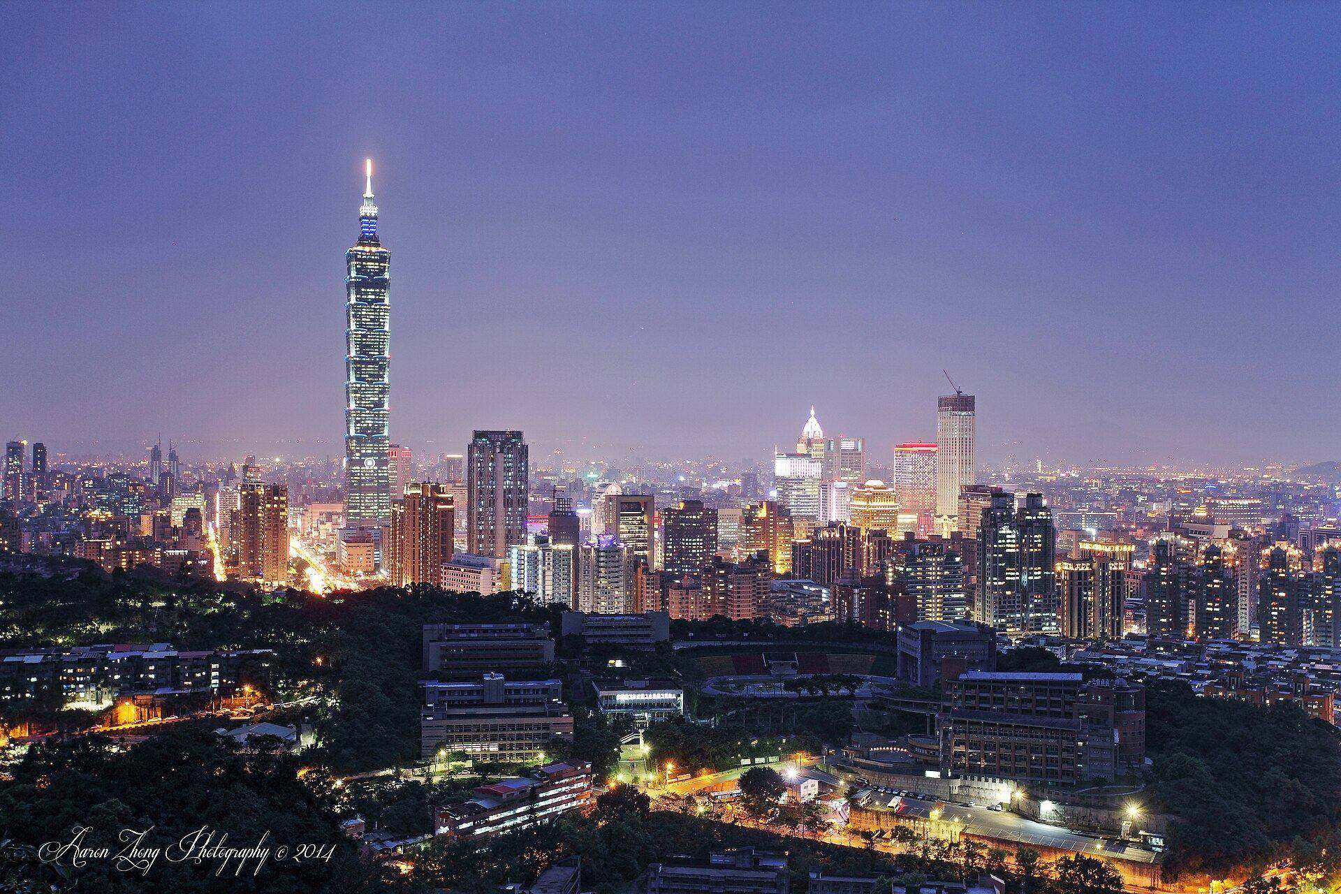 Night skyline of Taipei with Taipei 101 rising above the illuminated city towers